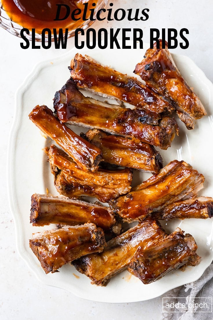 White tray full of bbq ribs - with text - addapinch.com