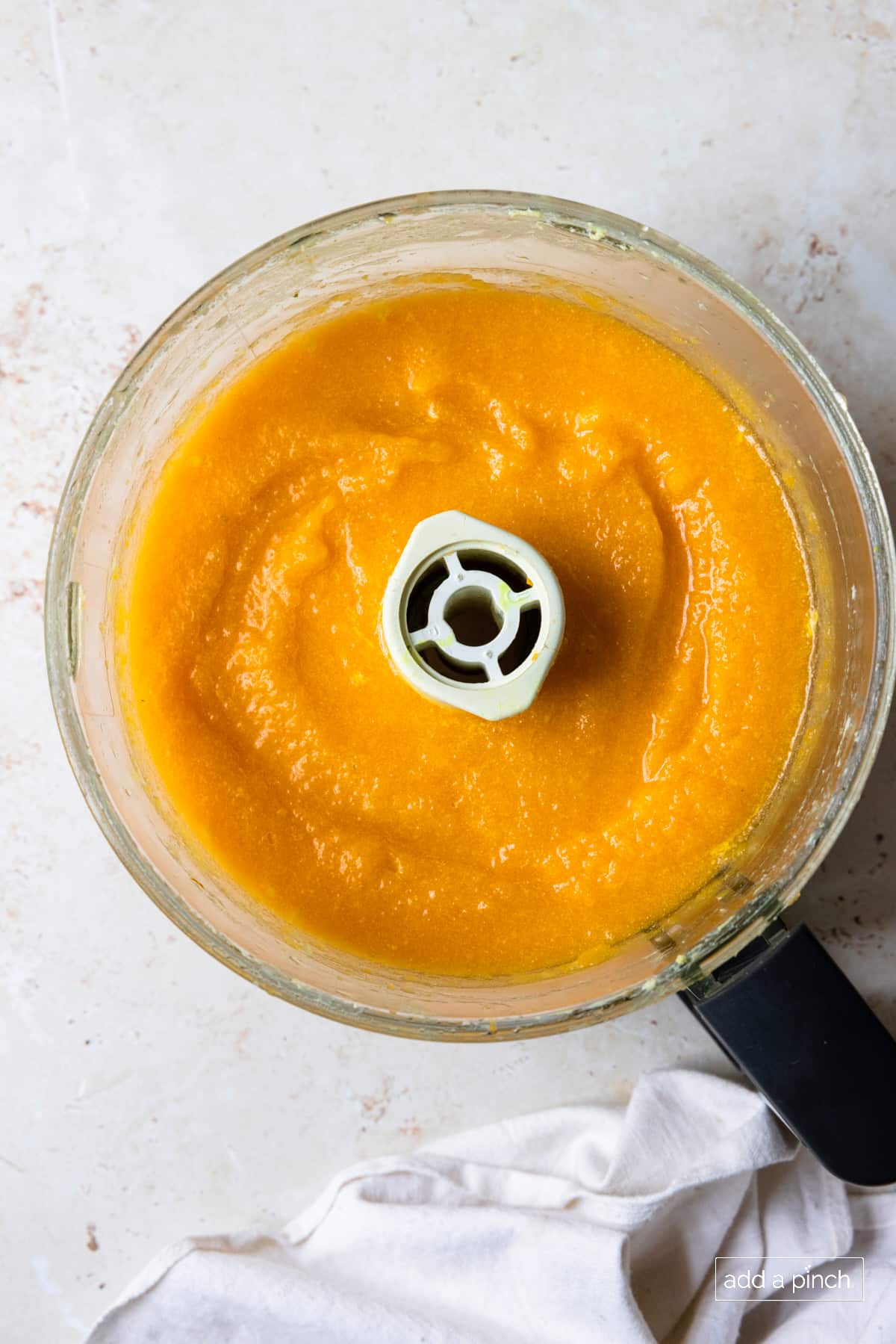 Roasted butternut squash soup in a food processor.