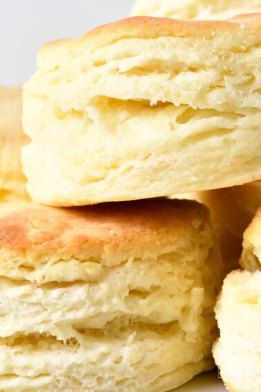 Closeup of flaky layers on a stack of golden biscuits.