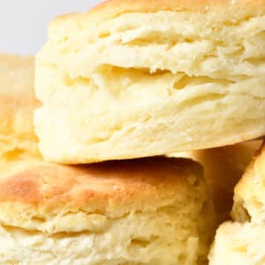 Closeup of flaky layers on a stack of golden biscuits.