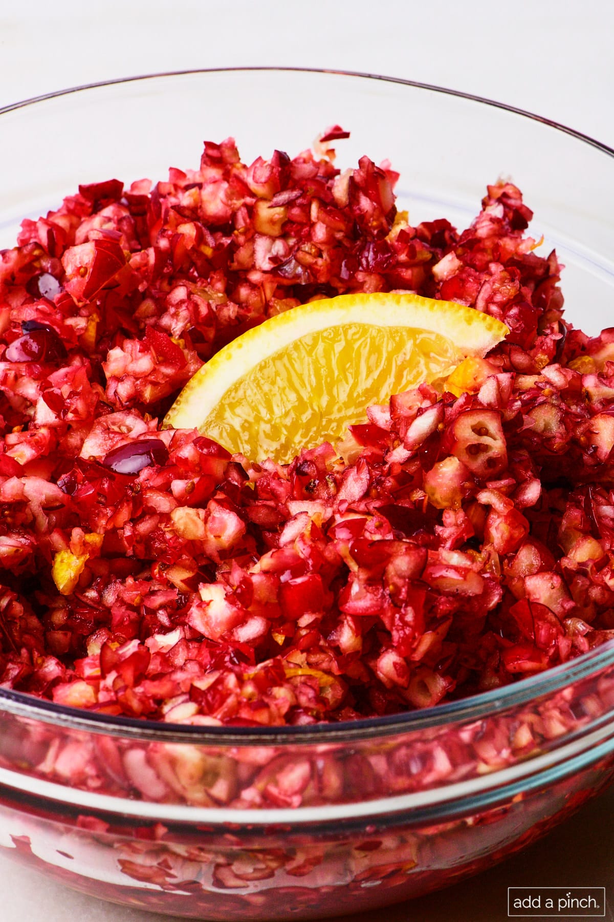 Fresh cranberry relish in a glass bowl.