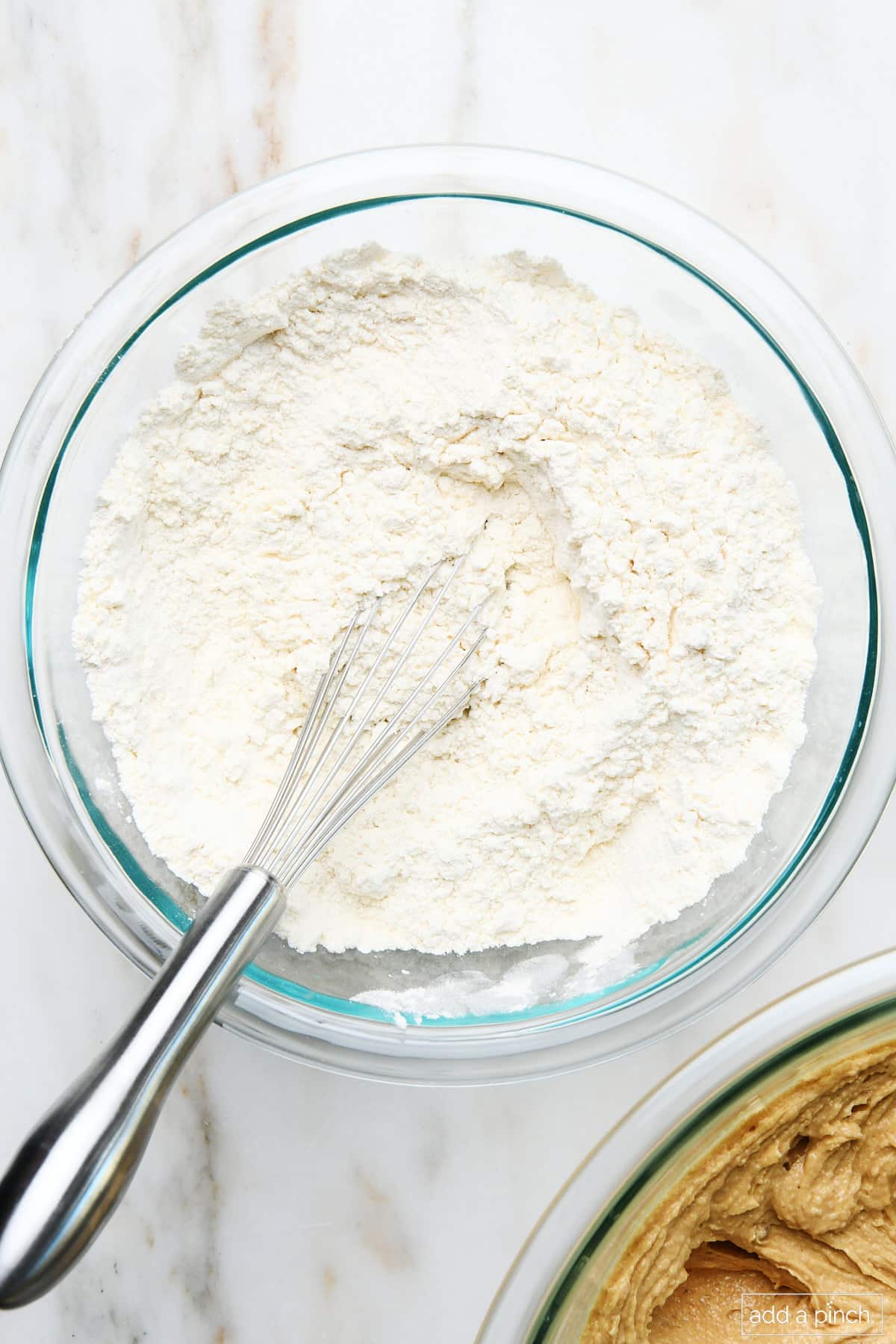 Combined flour and baking powder in a mixing bowl.