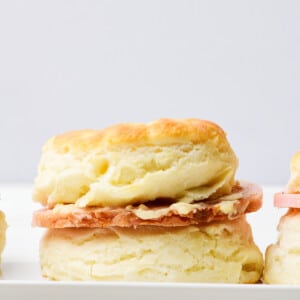 Southern ham biscuit with salty ham and honey butter spread.
