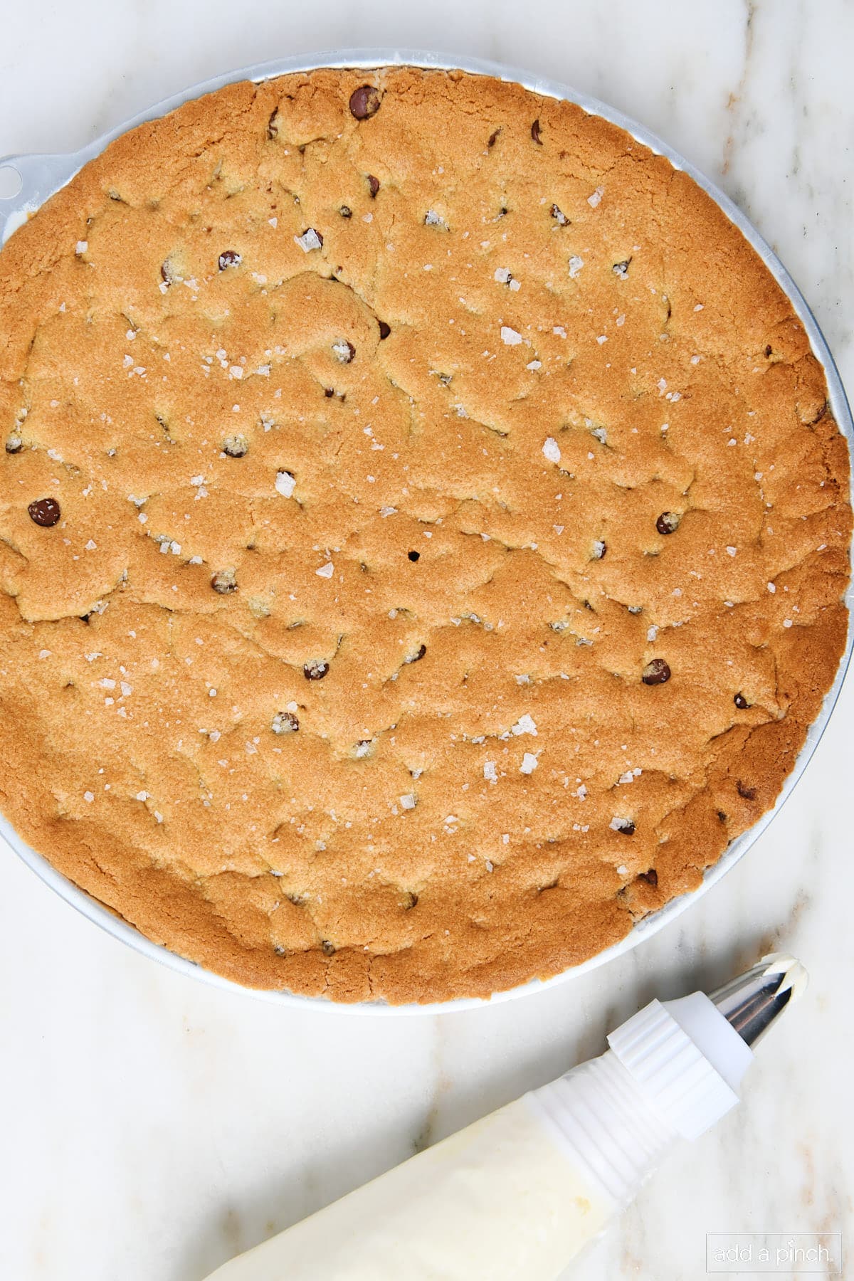 Golden brown baked chocolate chip cookie dough cake.