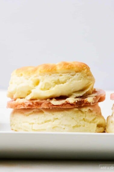 Southern ham biscuit with salty ham and honey butter spread.