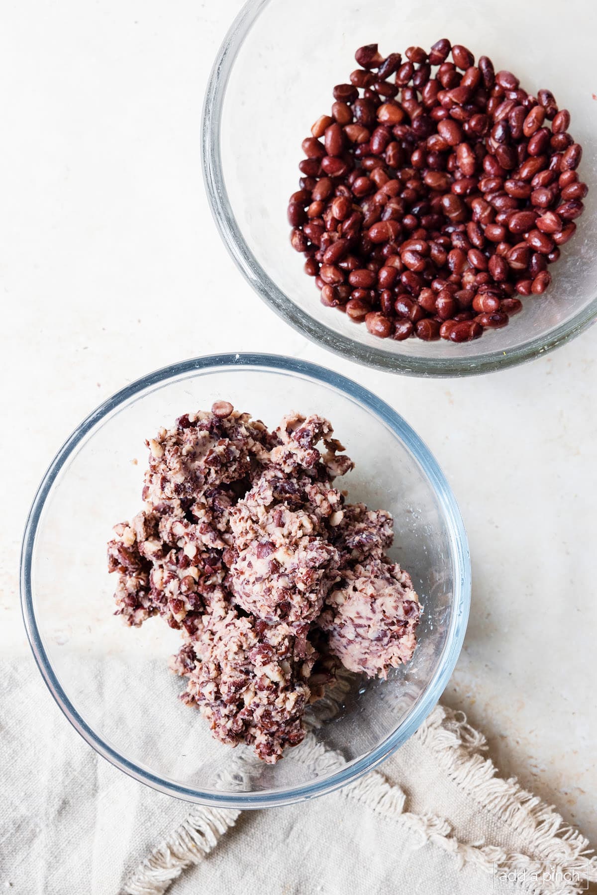 Pulse a portion of the black beans for the burgers in the blender, food processor or use a potato masher.