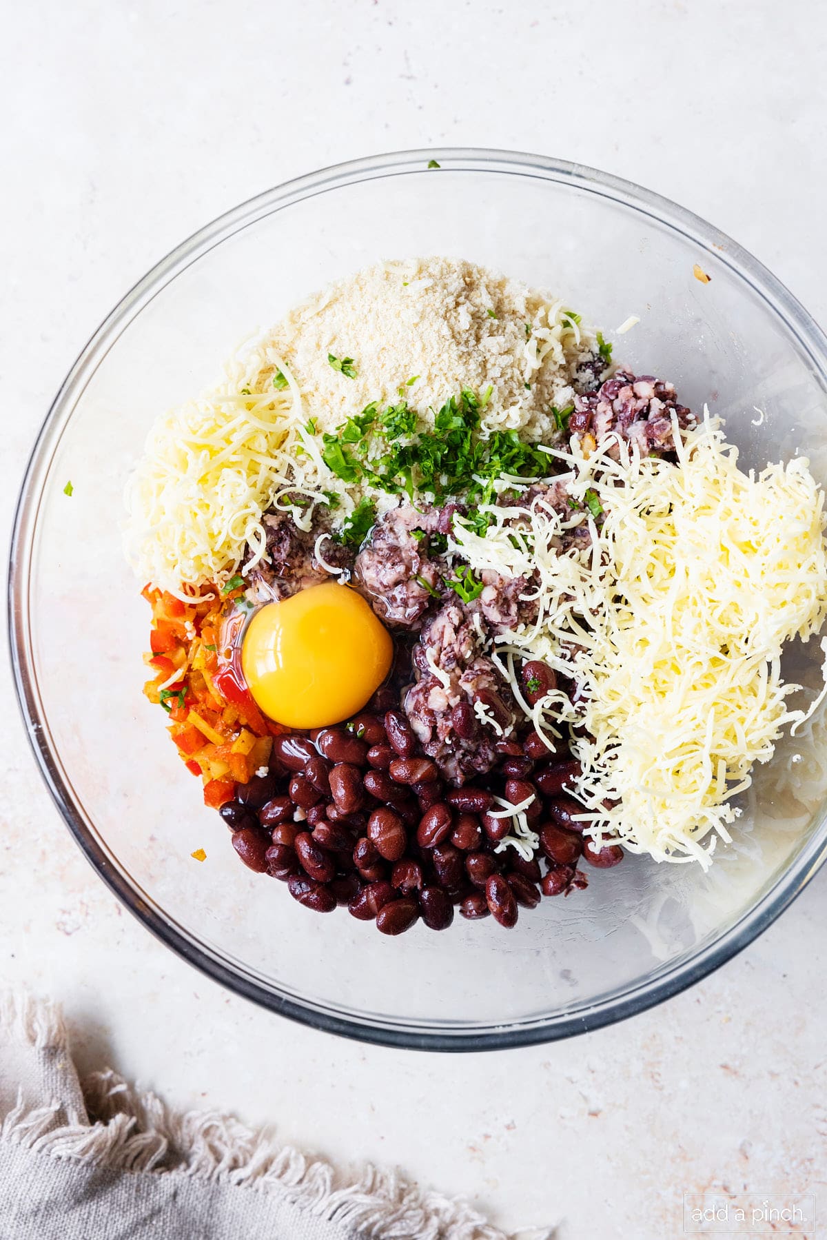 Mixture for making black bean burgers in a glass mixing bowl.