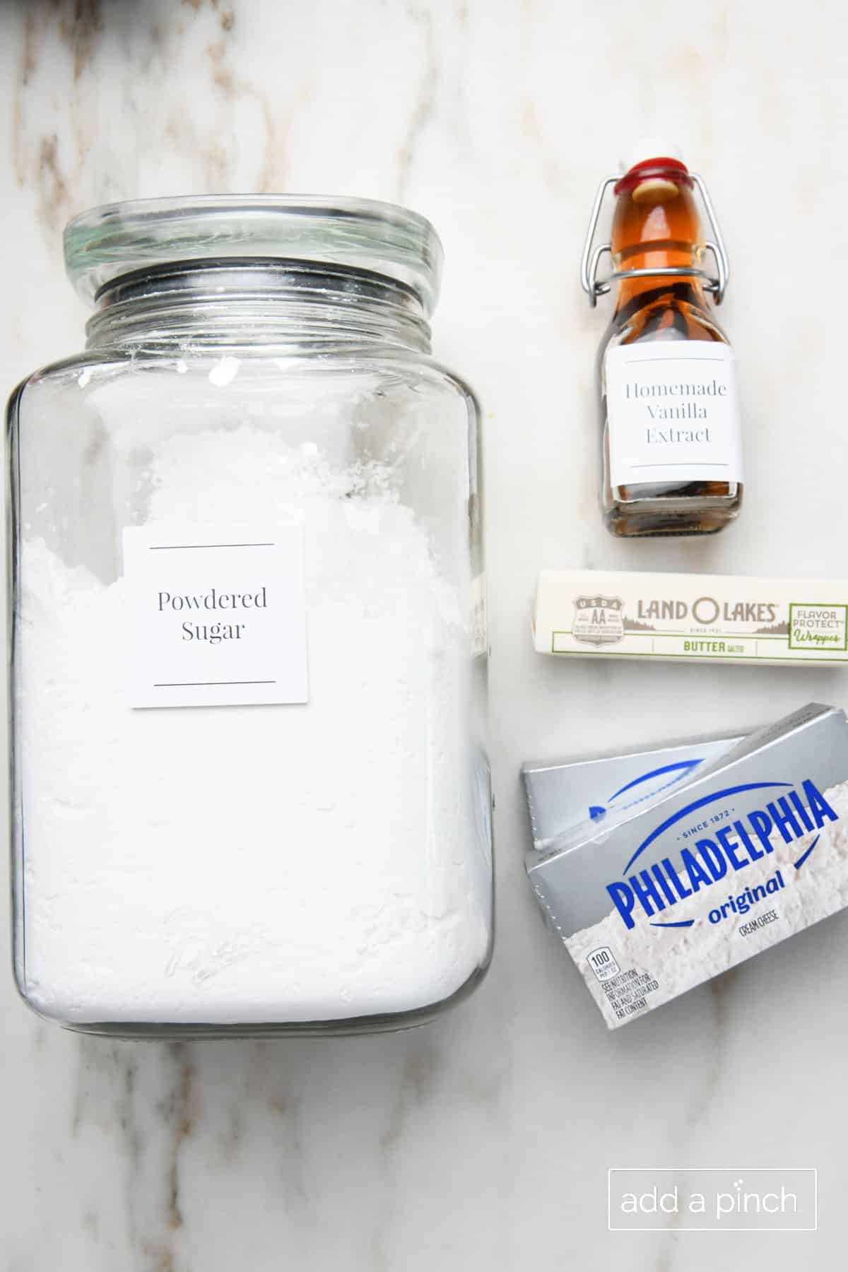 Ingredients for Cream Cheese Frosting recipe - Powdered Sugar, Vanilla, Butter and Cream Cheese. 