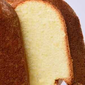 Southern Cream cheese pound cake on a glass cake stand.