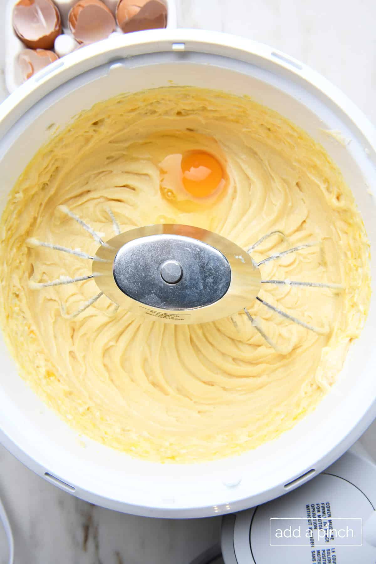 Add eggs one at a time to cake batter for best cream cheese pound cake.