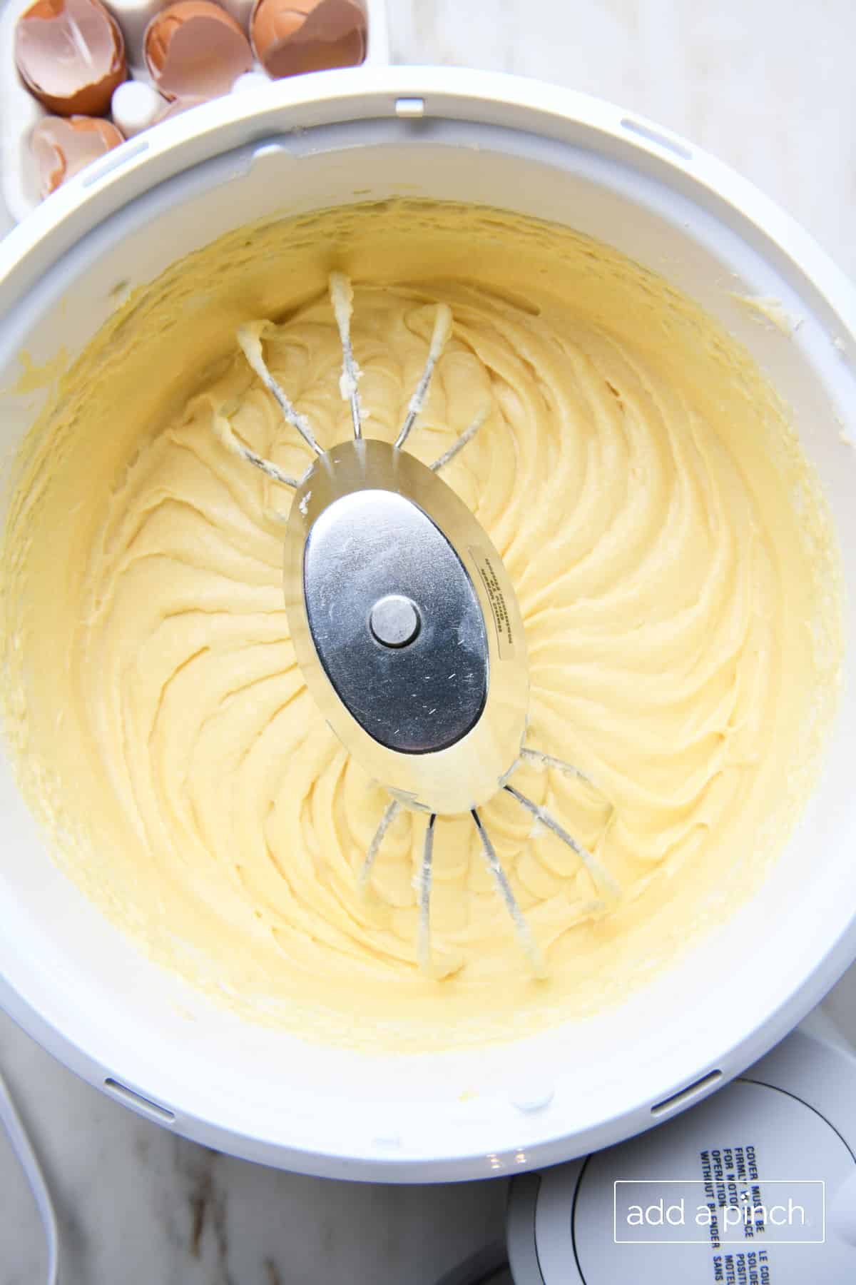 Stand mixer holds batter mixed with the eggs. 