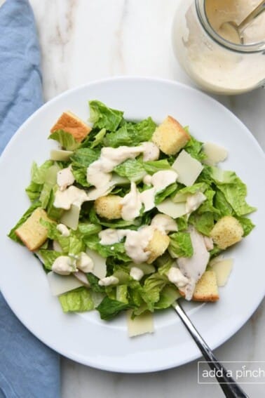 Caesar salad with Caesar dressing and croutons.