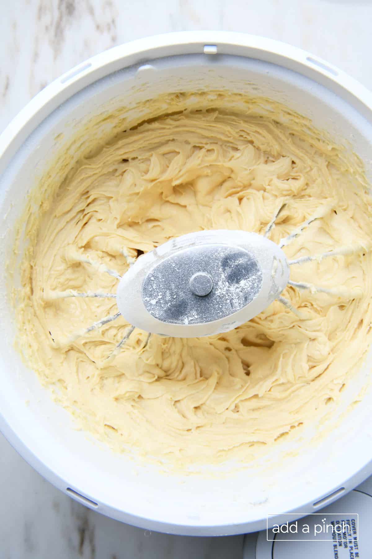 Lemon pound cake batter after all ingredients have been mixed together in the stand mixing bowl.