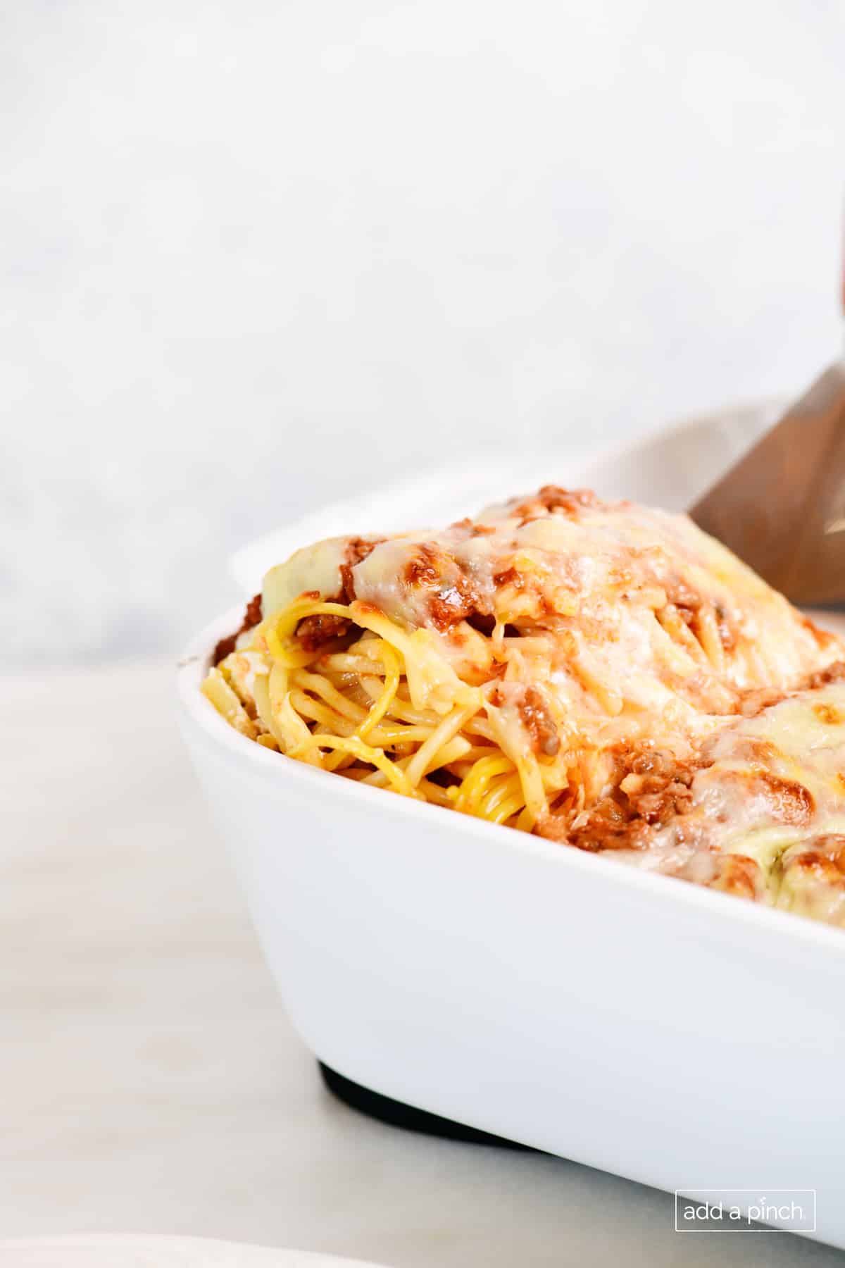 Baked million dollar spaghetti in a baking dish.