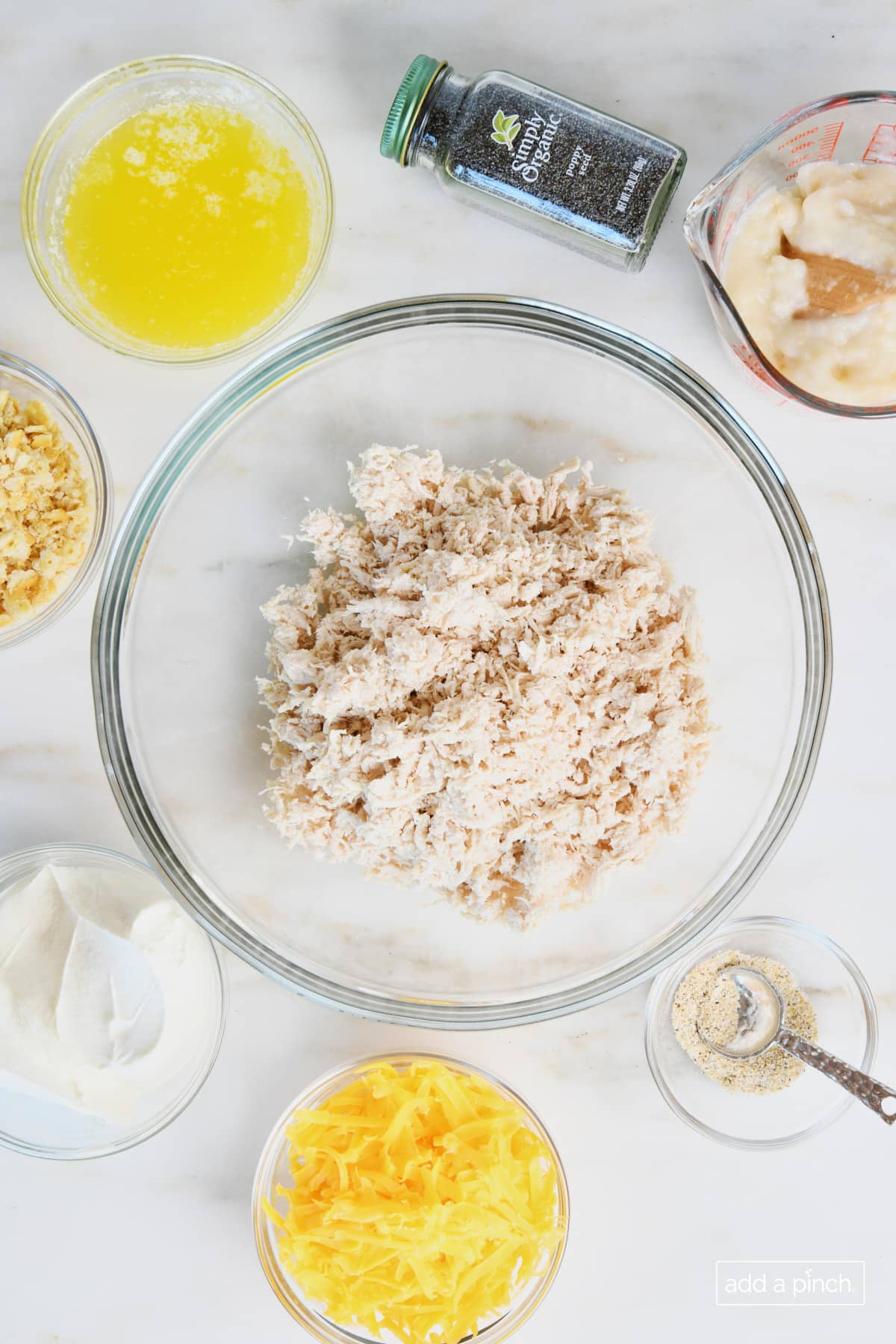 Ingredients to make Poppy Seed Chicken in glass bowls. 