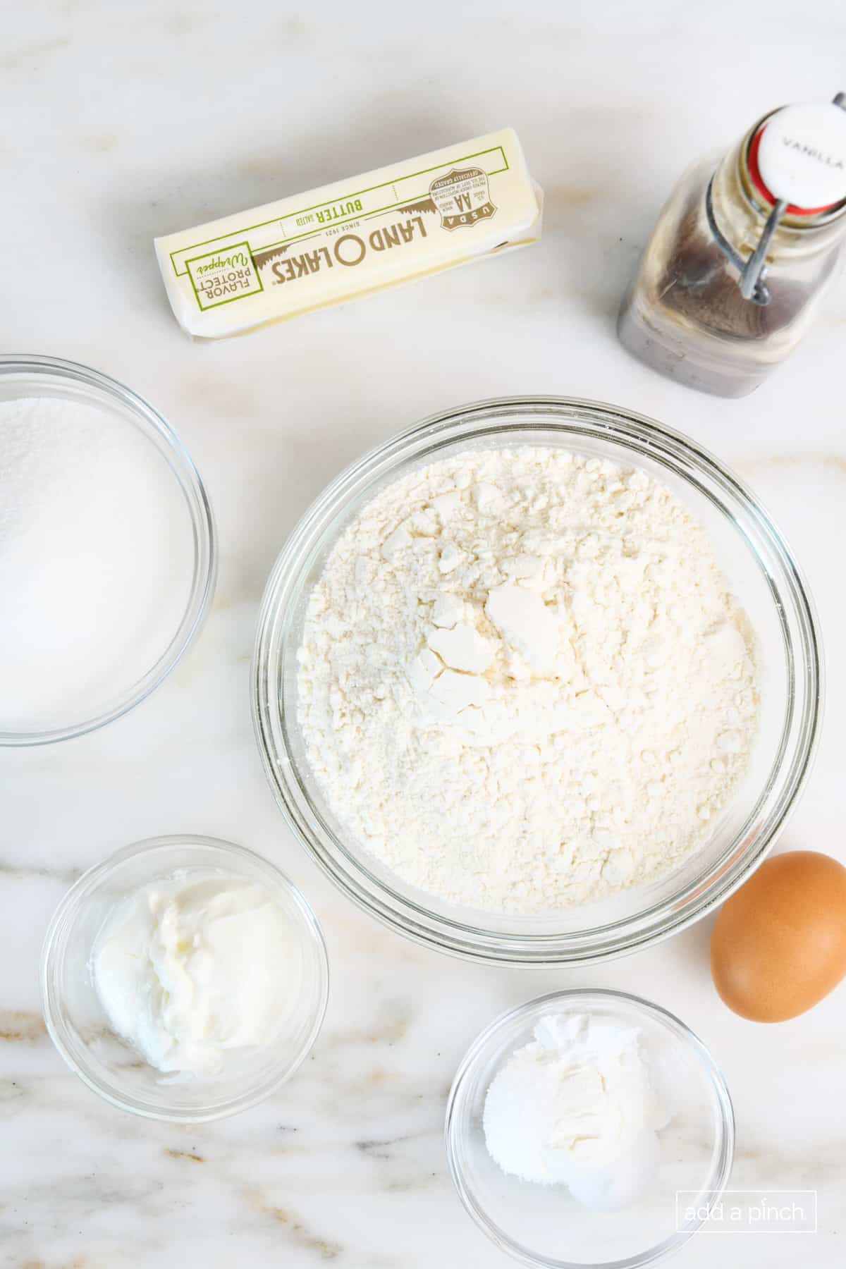 Ingredients to make Lofthouse Cookies on a marble surface.