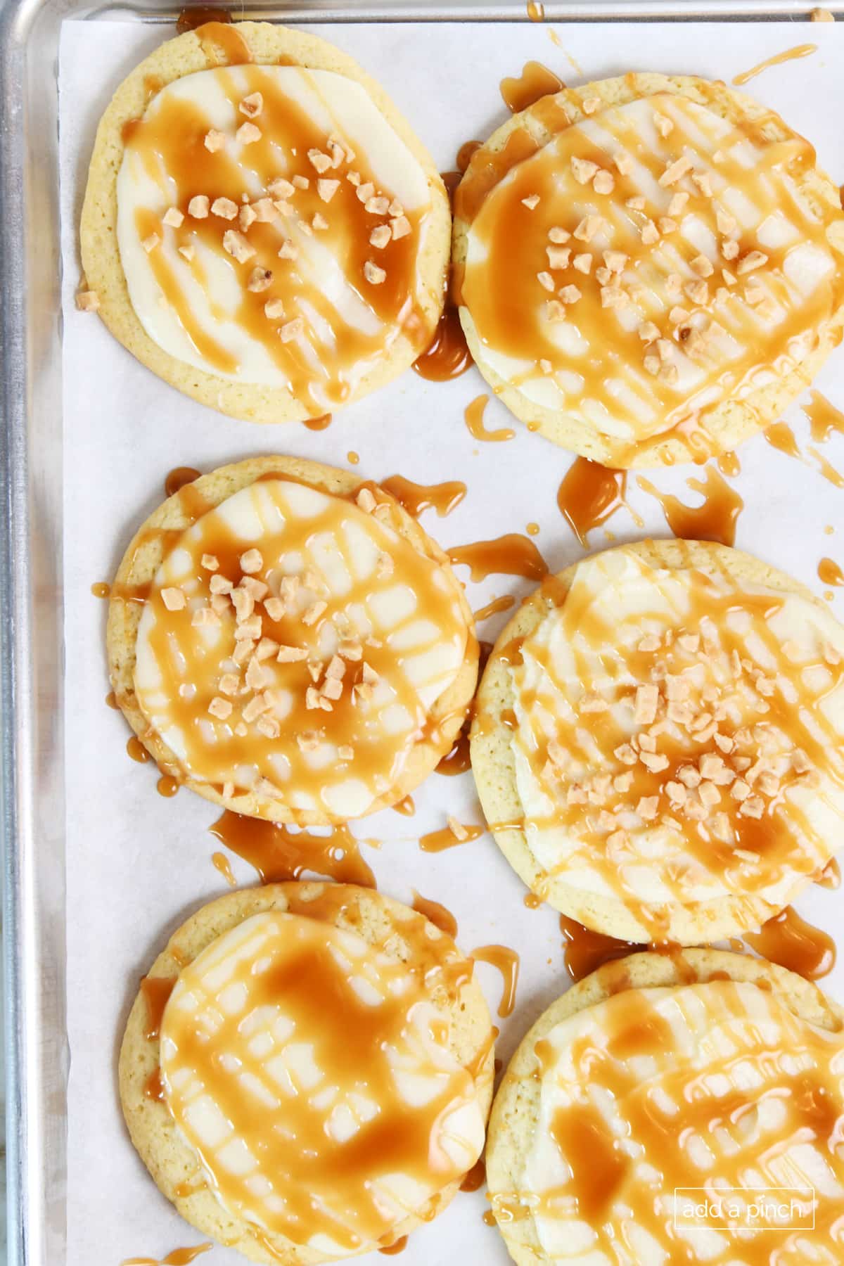 Decorated Lofthouse Cookies with salted caramel and Heath bits.