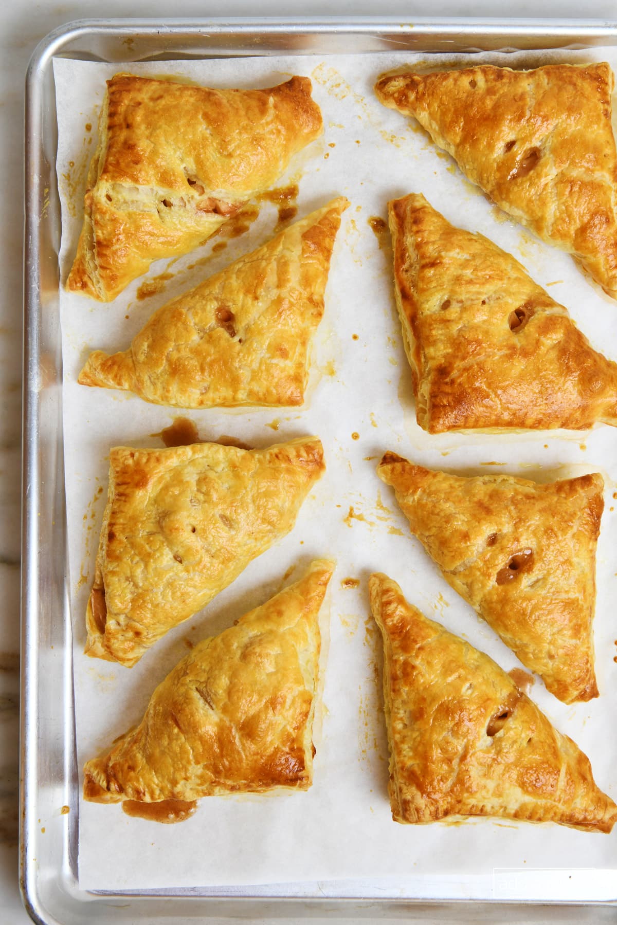 Baked apple turnovers cooling to serve.