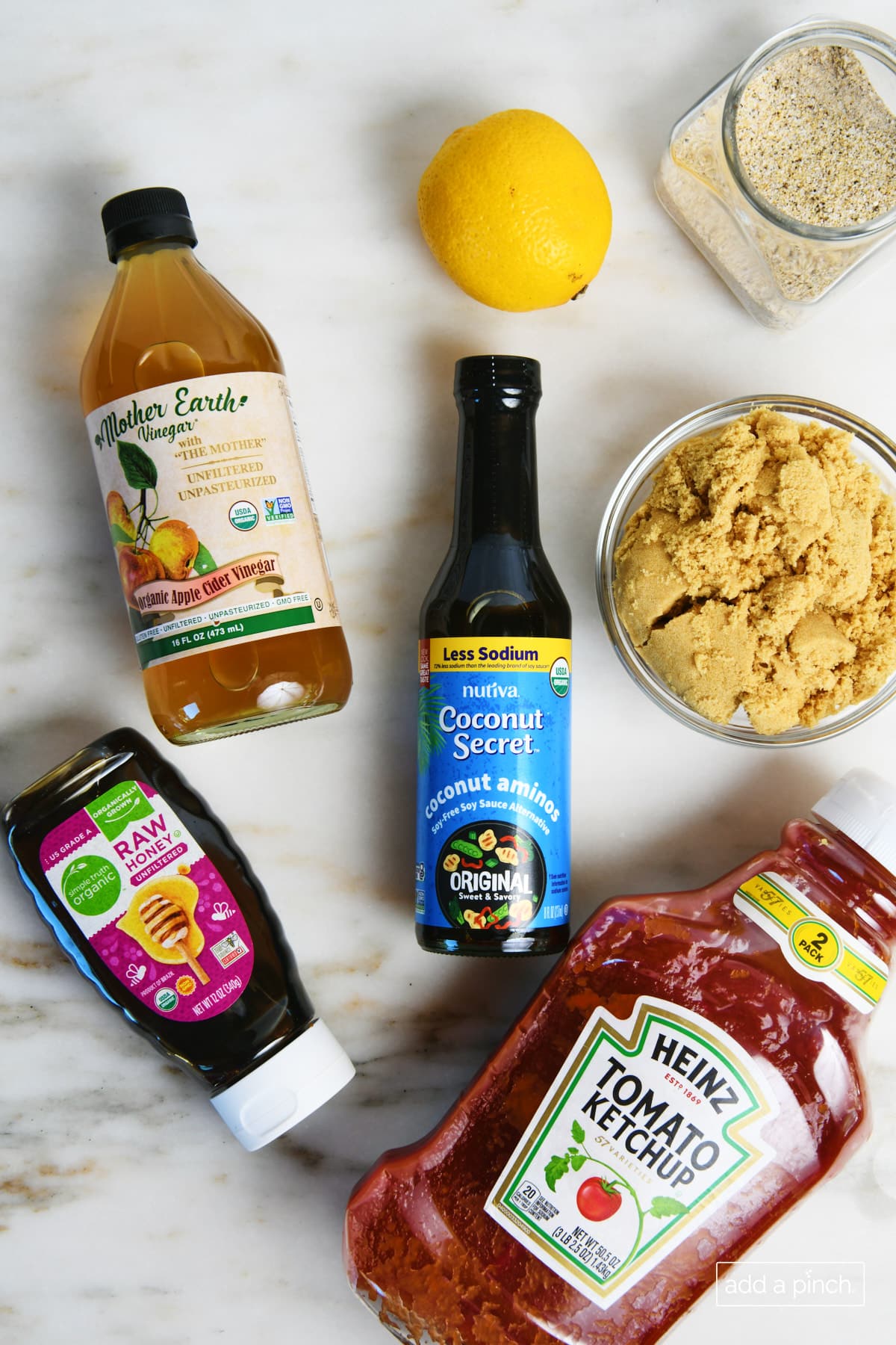 Ingredients to make homemade BBQ Sauce on a marble countertop.