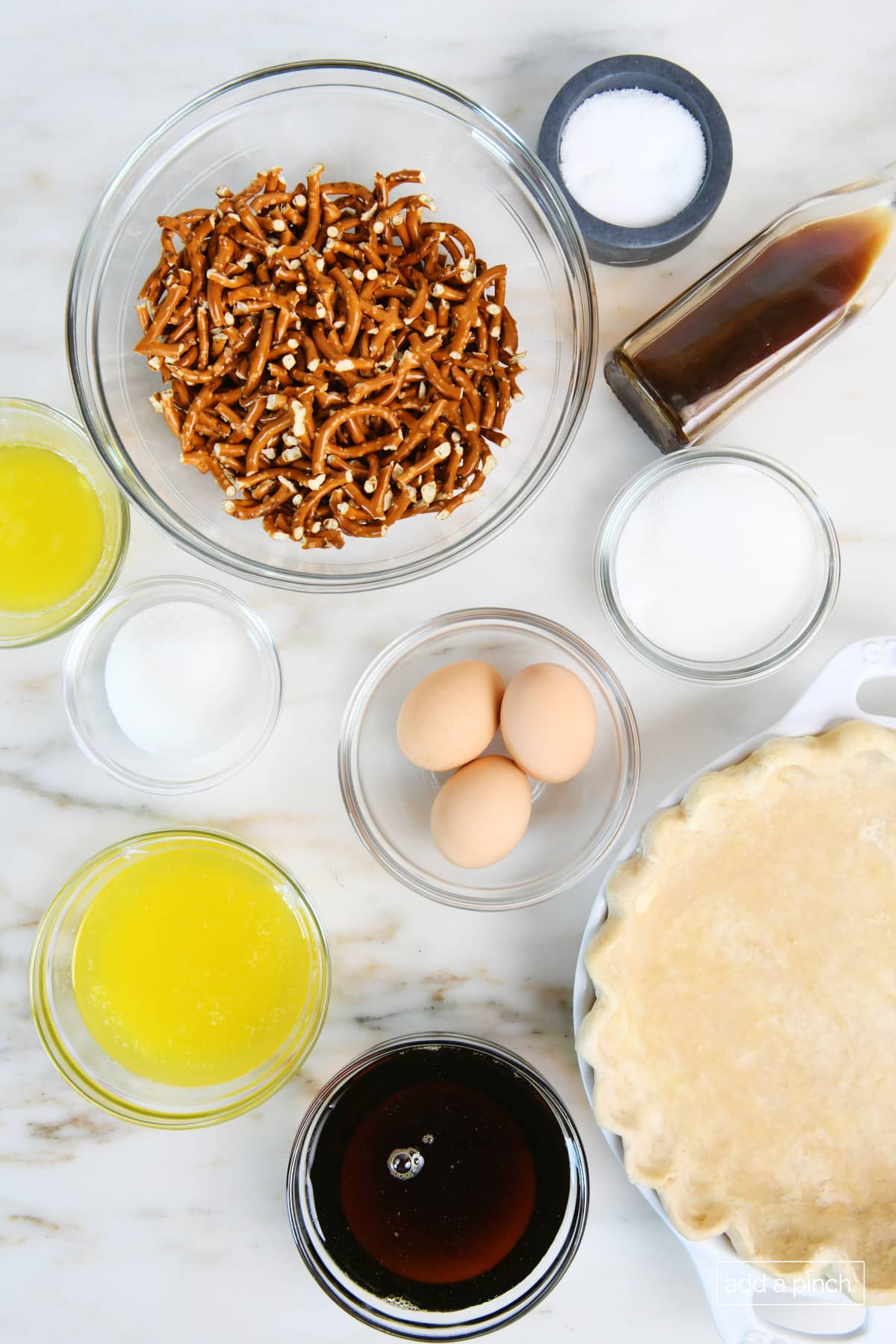 Ingredients to make mock pecan pie on a marble counter.