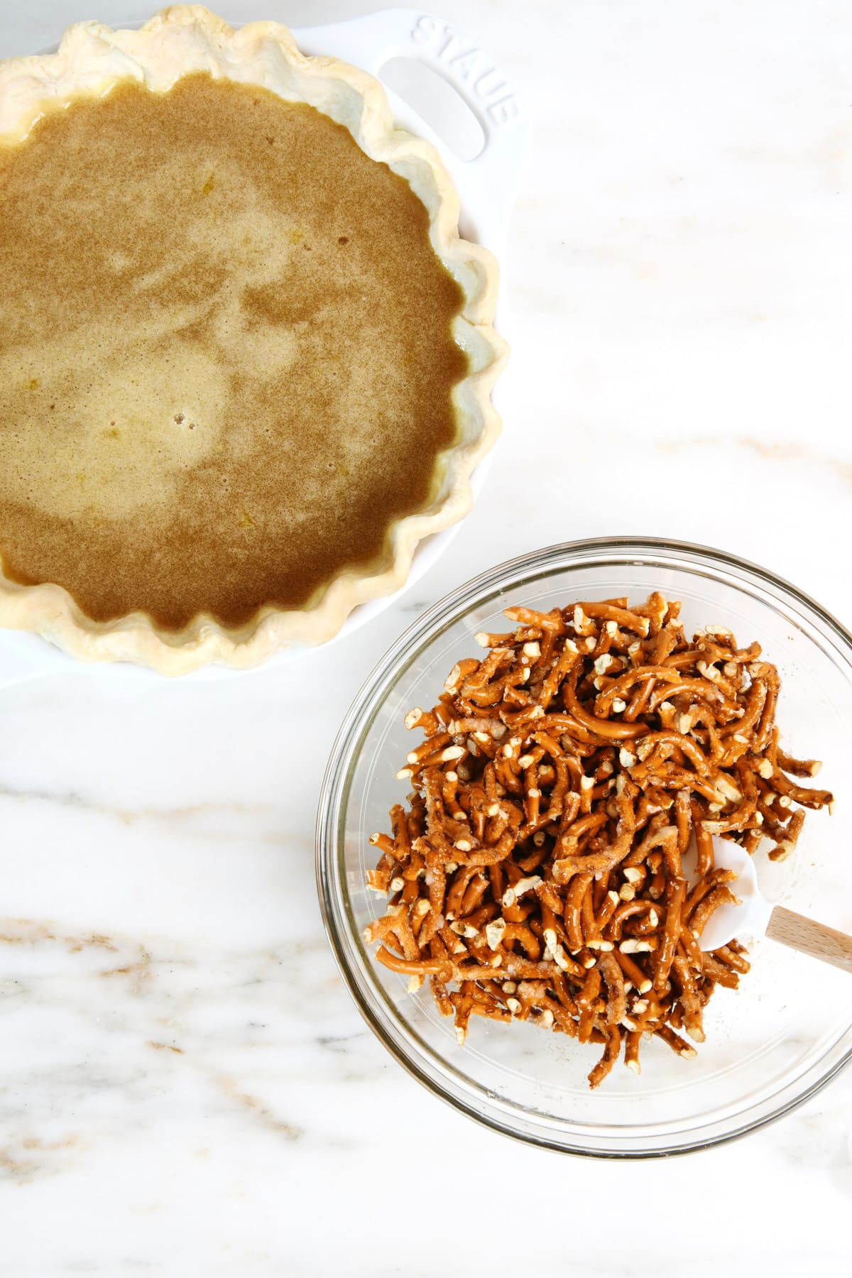 Coat the pretzel pieces with butter and sugar.