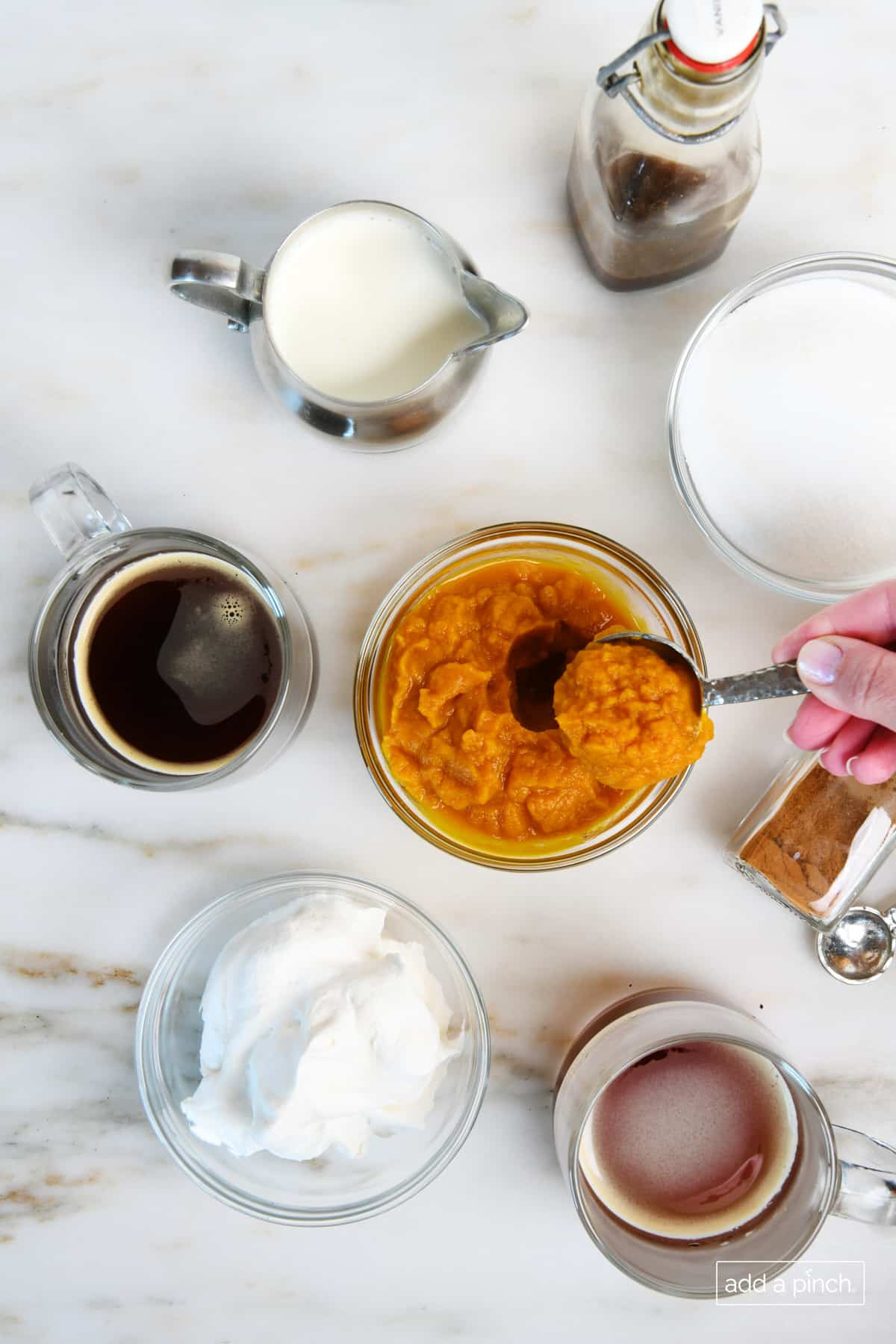 Ingredients for hot pumpkin spice latte.