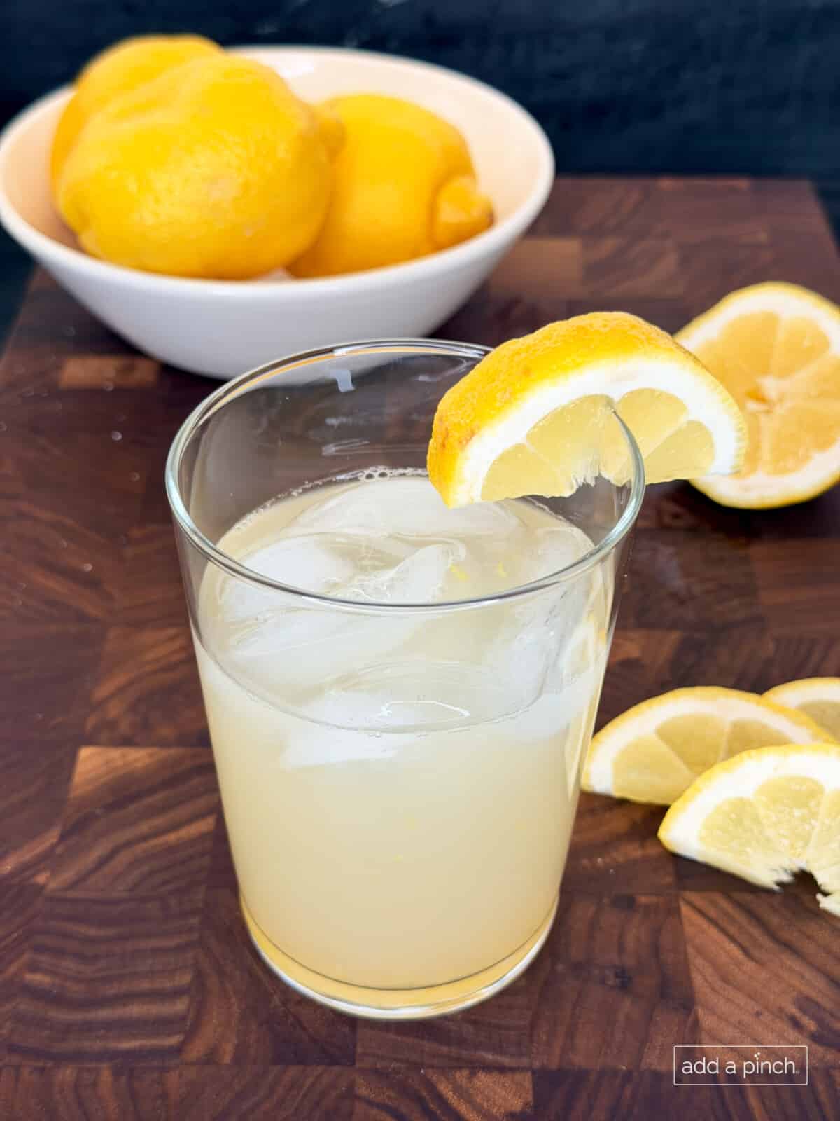 Fresh homemade lemonade in a glass with lemon slices.