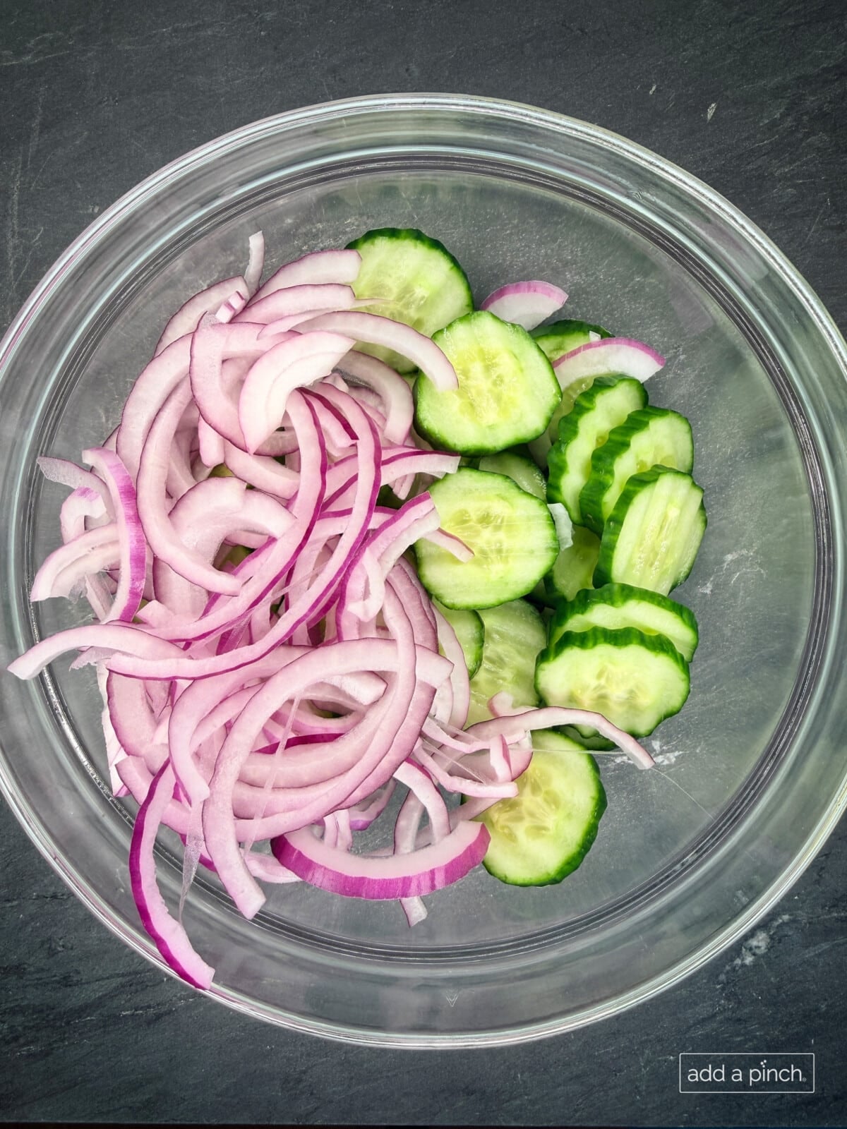 Step-by-step prep: peeled and sliced cucumbers with red onions for beginner-friendly cucumber salad