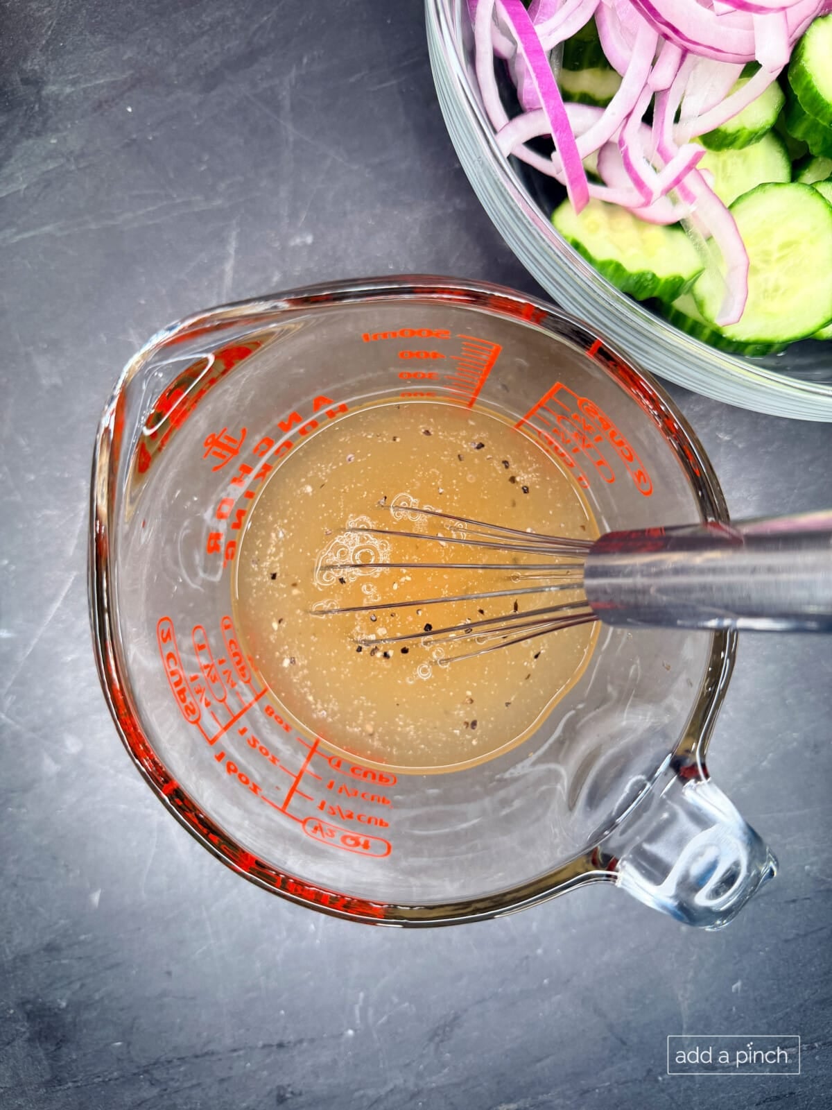 Make the dressing: Whisk together the apple cider vinegar, water, and seasoning until combined.