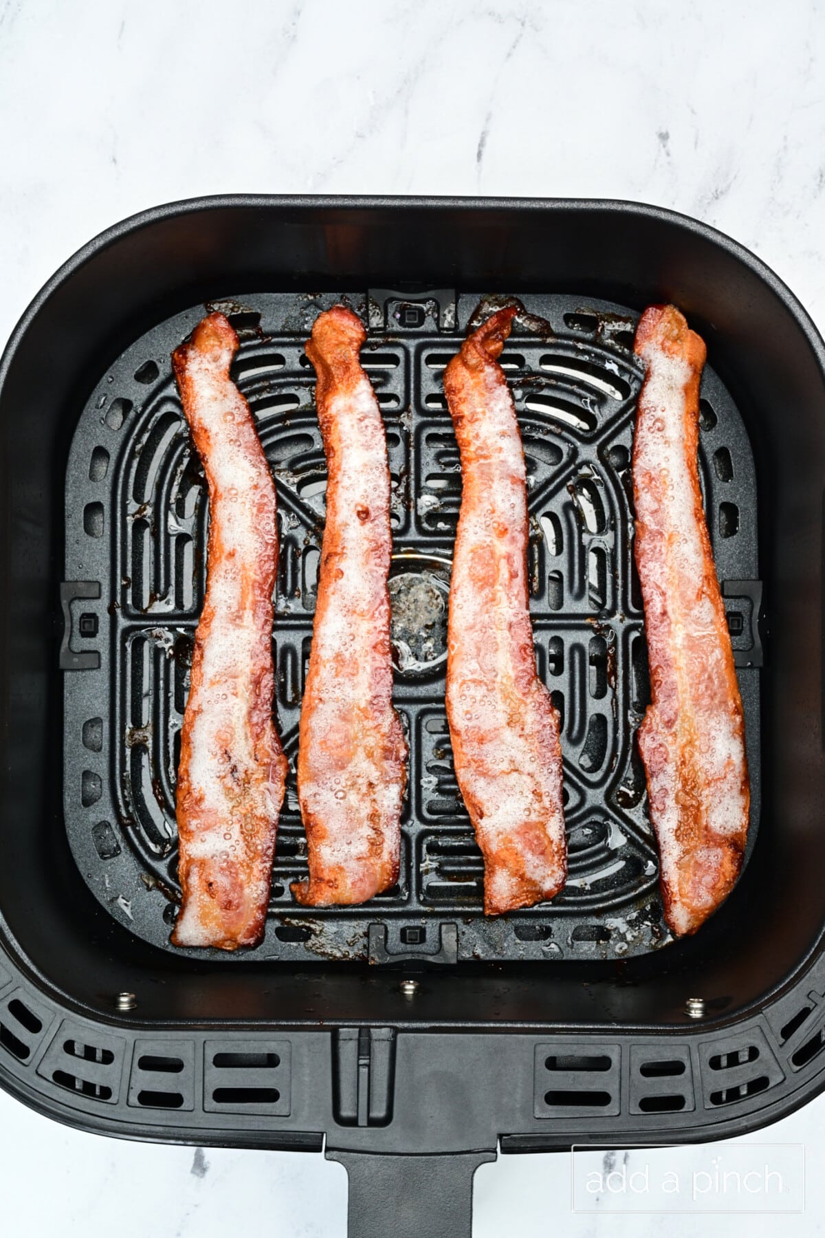 Cooked bacon in air fryer.