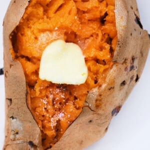 Air Fryer Sweet Potato opened with a pat of butter and sprinkle of salt.