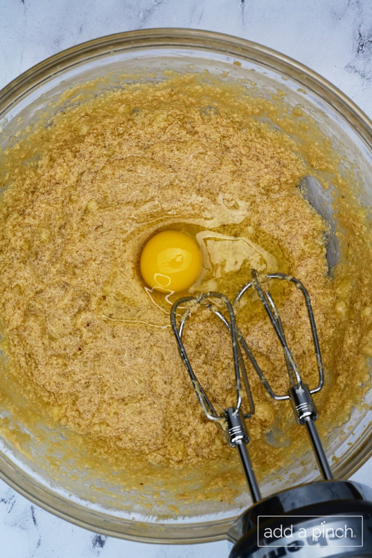 Large eggs are blended one at a time into banana mixture.