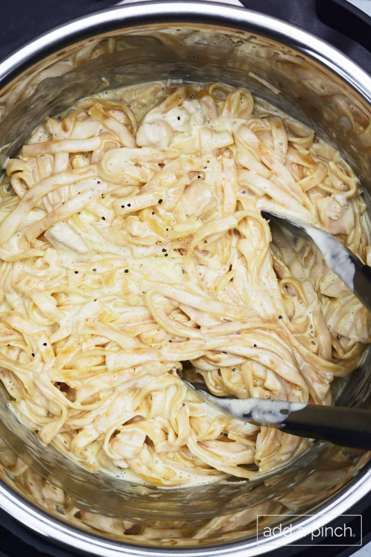 Stir to incorporate the chicken, noodles, and the creamy sauce all together in the Instant Pot for serving.