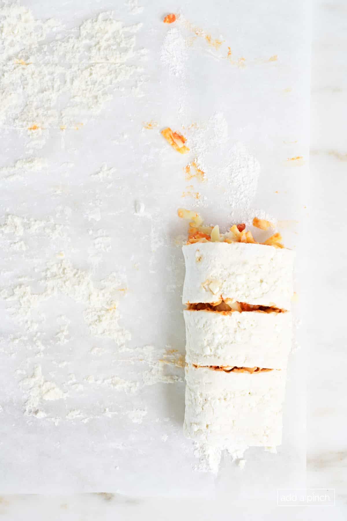 Pizza roll cut into pieces.