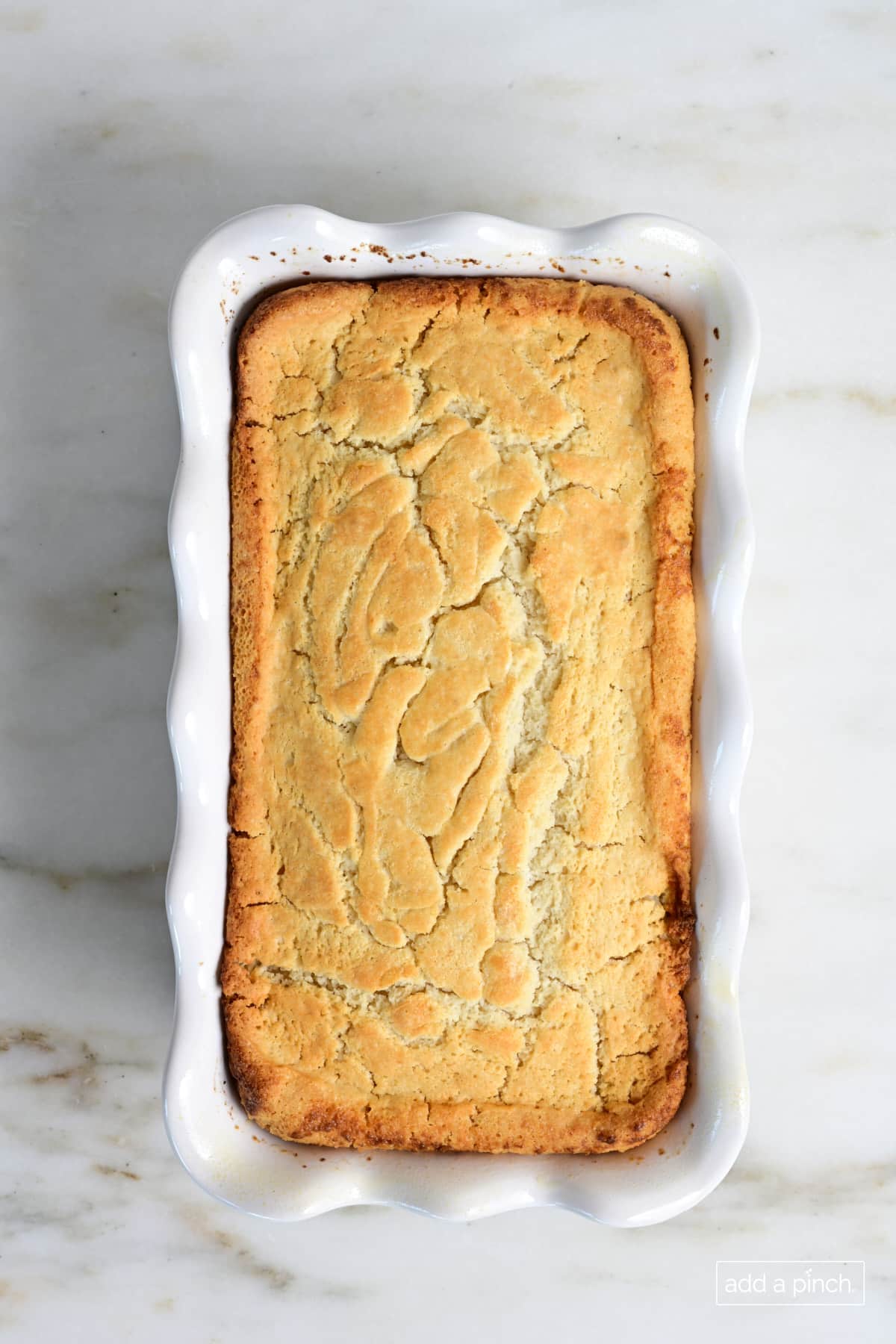 Baked beer bread in a loaf pan.