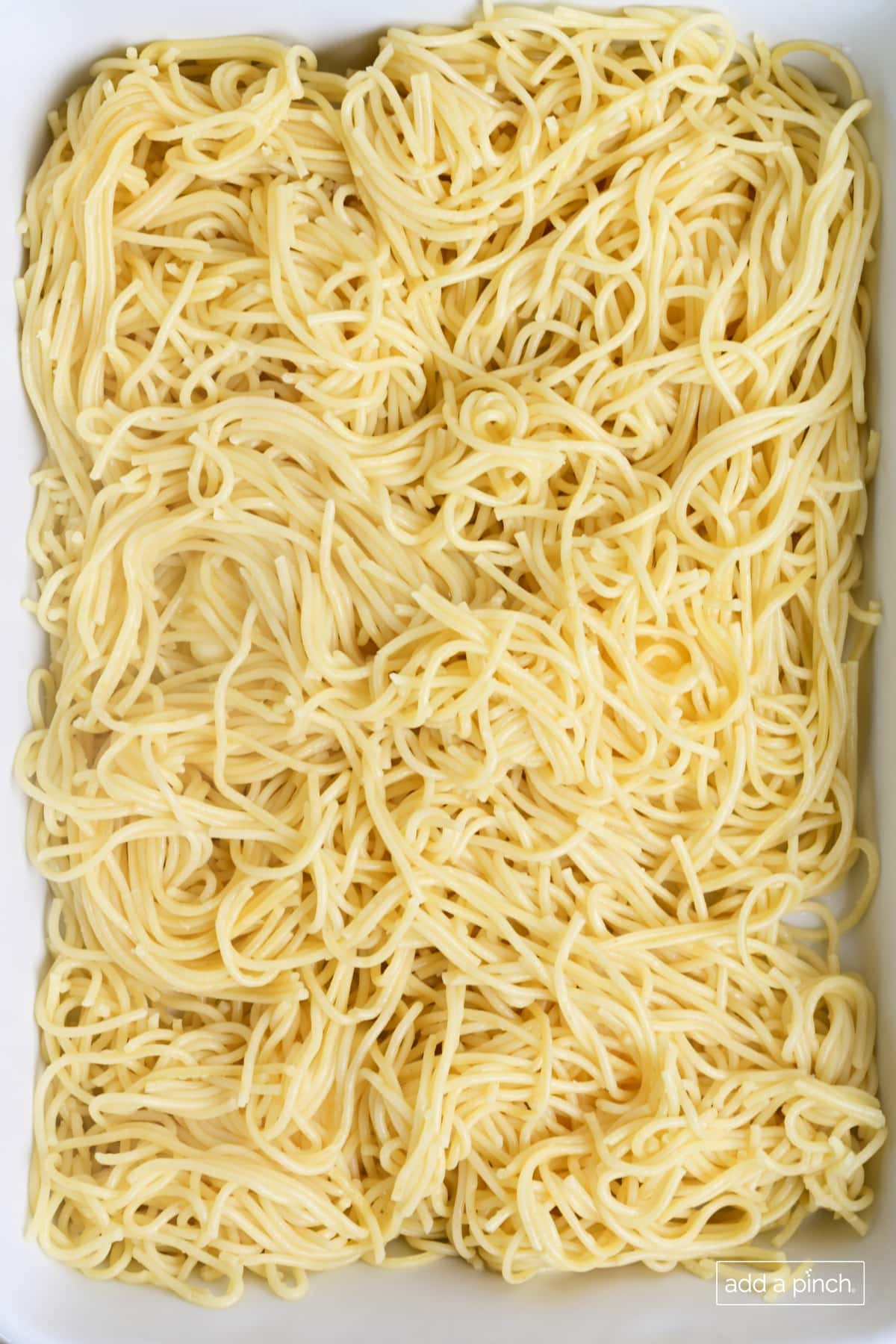 Spaghetti in baking dish.