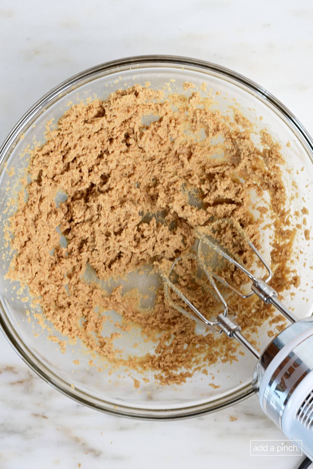 Creamed together brown sugar and butter in glass mixing bowl.