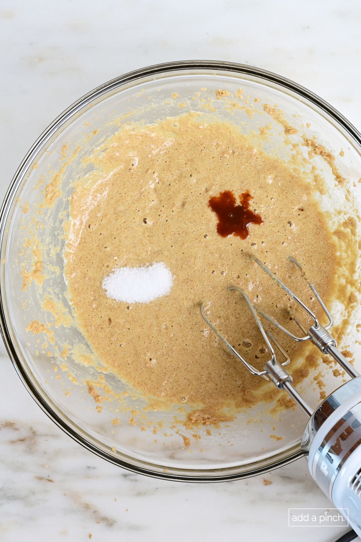 Vanilla extract and salt added to muffin batter.