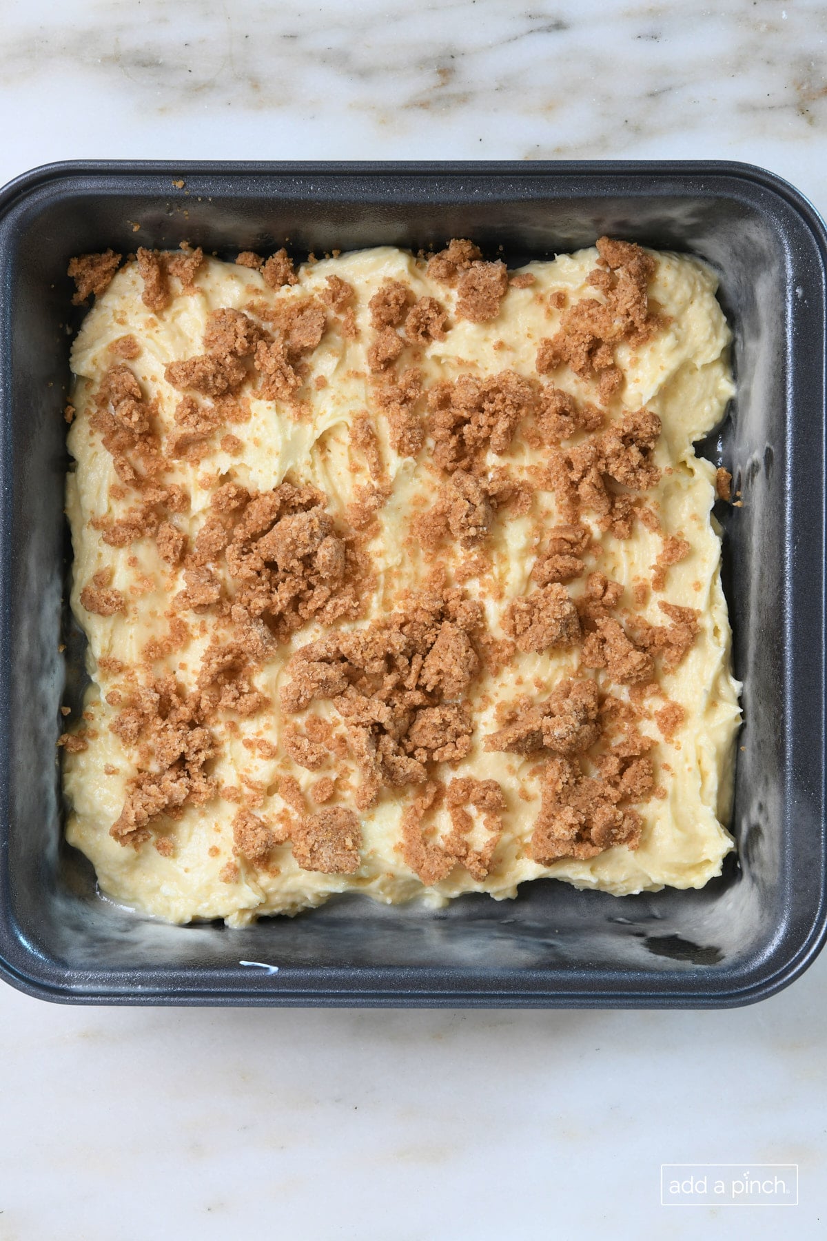 Half of the crumb layer on the cake batter.