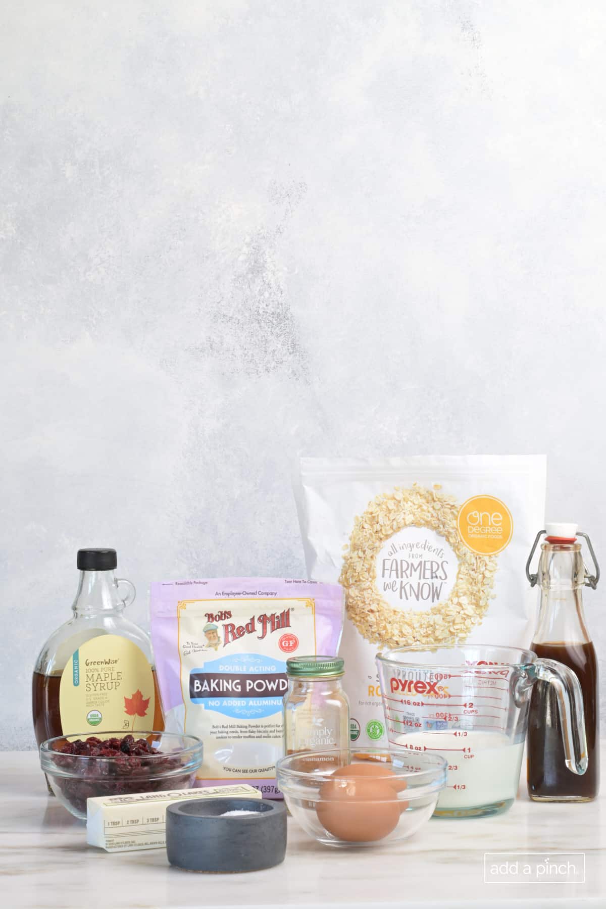 Ingredients for baked oatmeal on a marble counter.