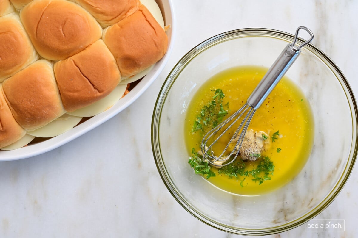 Whisk together the butter topping for the sliders.