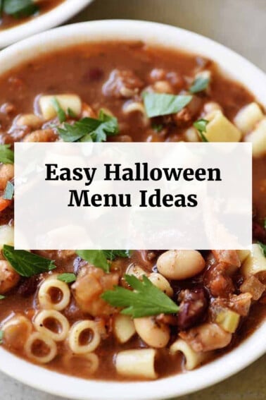 Pasta fagioli in a white bowl with text box overlay that says, "Easy Halloween Menu Ideas"