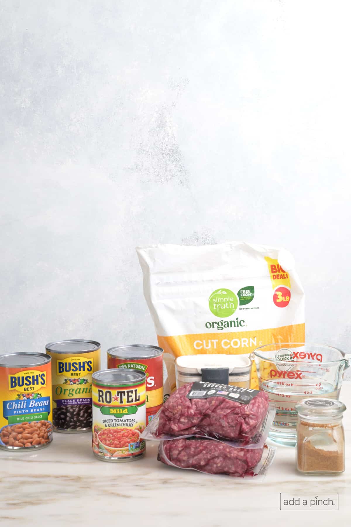 Best taco soup recipe ingredients on a white marble countertop.