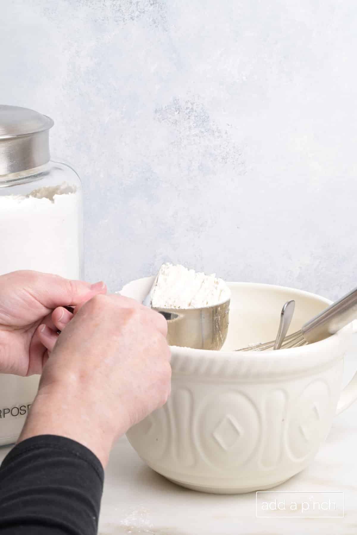 Step-by-step spoon and level method for accurate flour measurement.