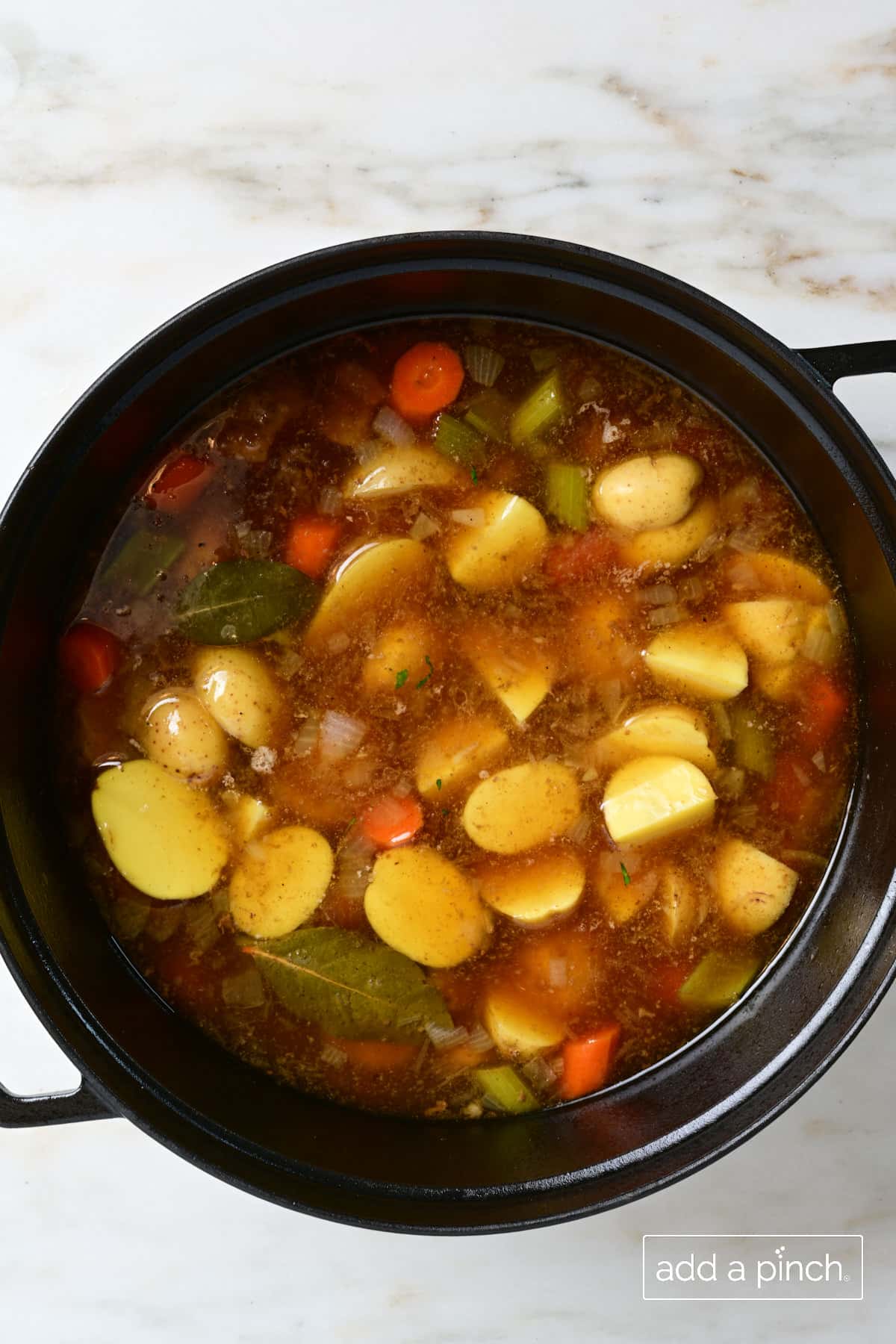 Potatoes added to Irish stew ready for final cooking.