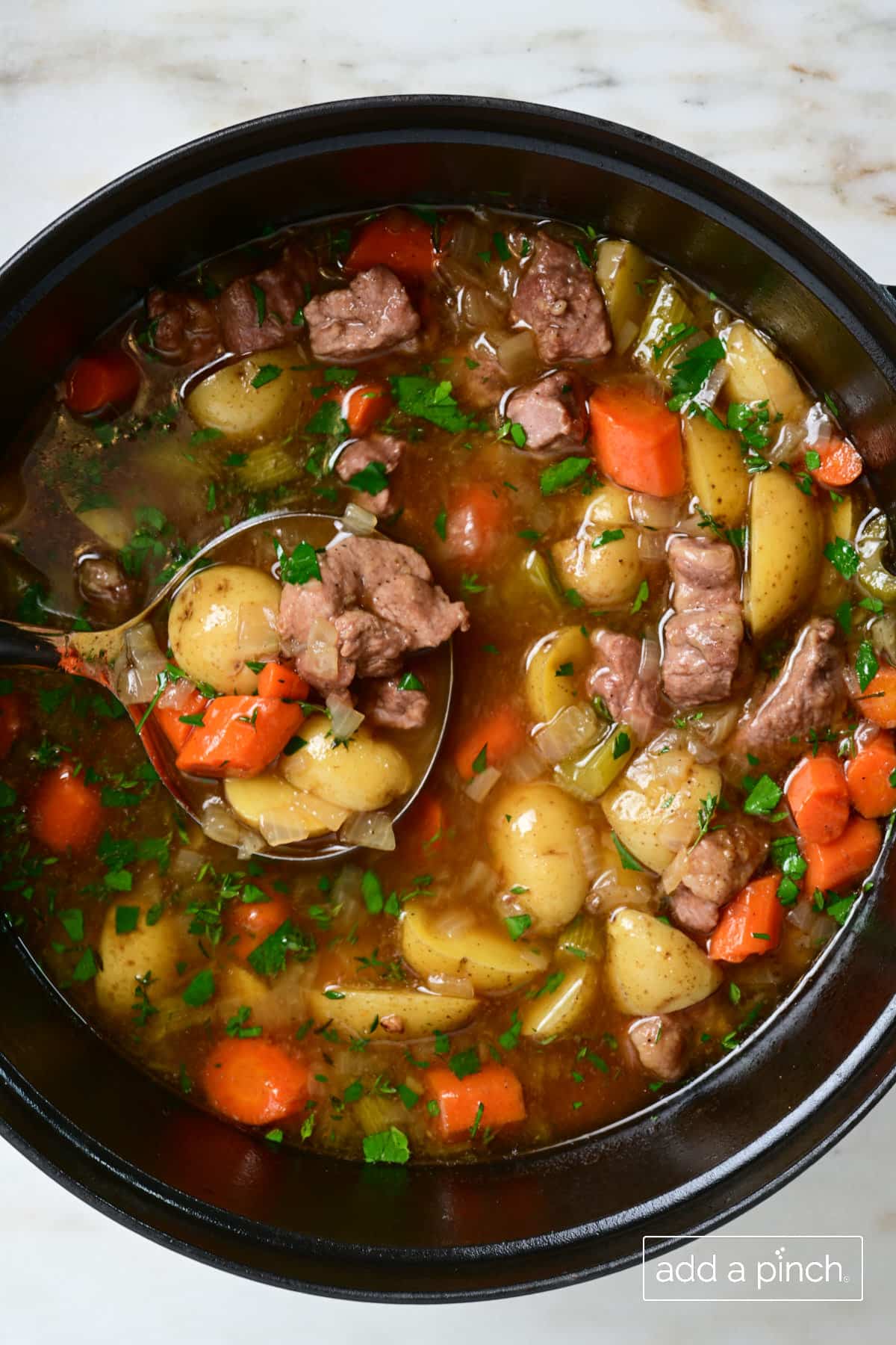 Easy homemade Irish Stew with vegetables and herbs in a rich, hearty stock.