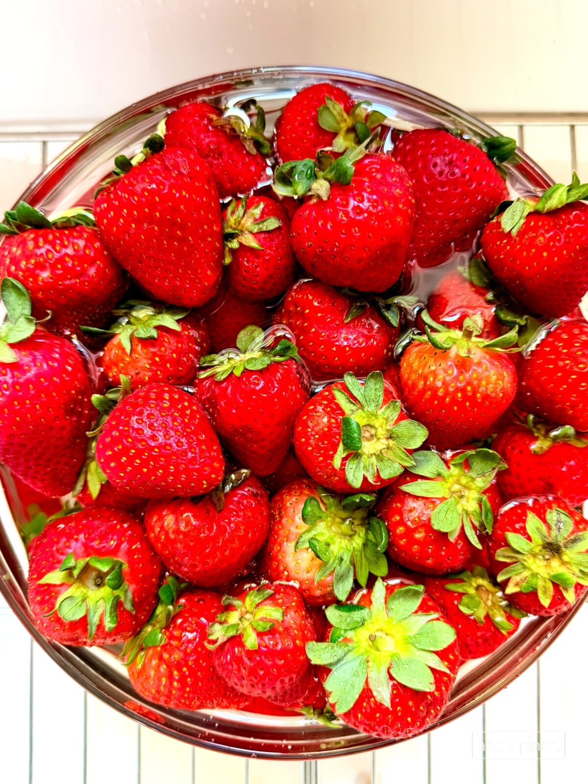 Fresh strawberries being washed to be prepped for the strawberry icebox cake.