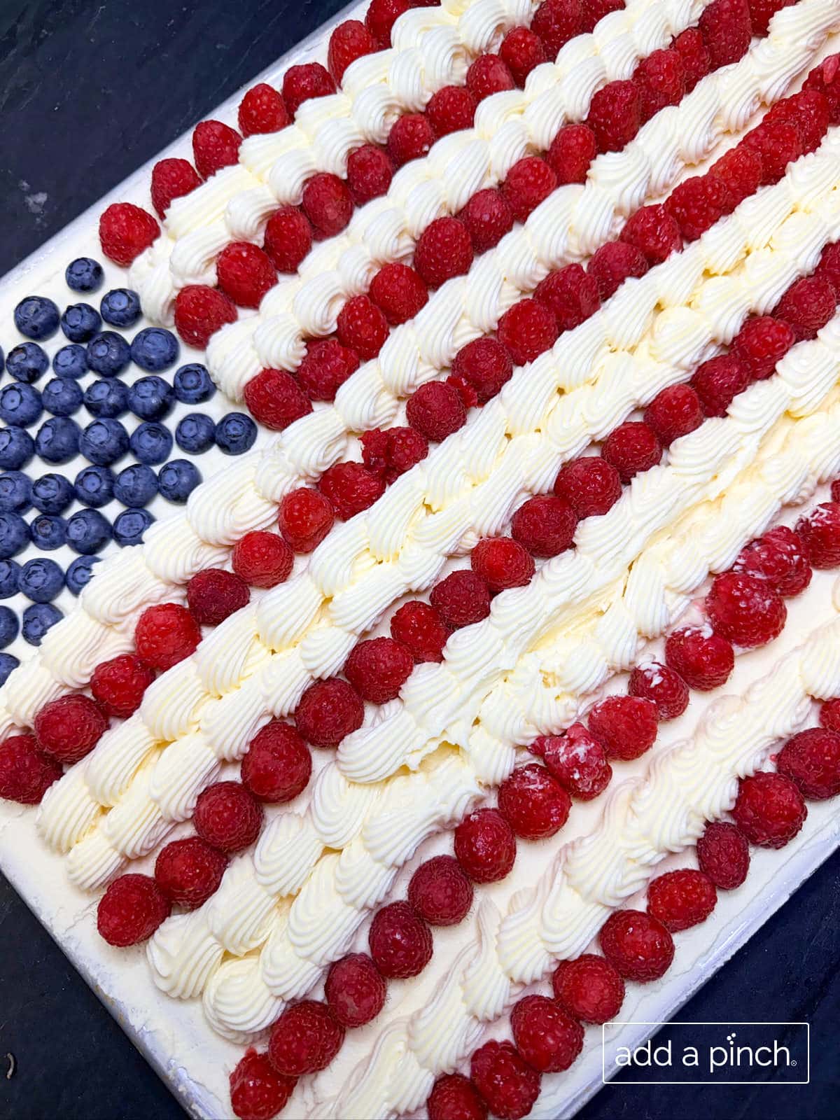Patriotic Sugar Cookie Flag Cake made with Add a Pinch chewy sugar cookies, perfect for Fourth of July celebrations