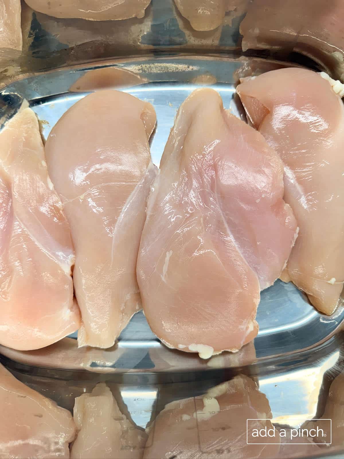 Chicken breasts in slow cooker, unseasoned.