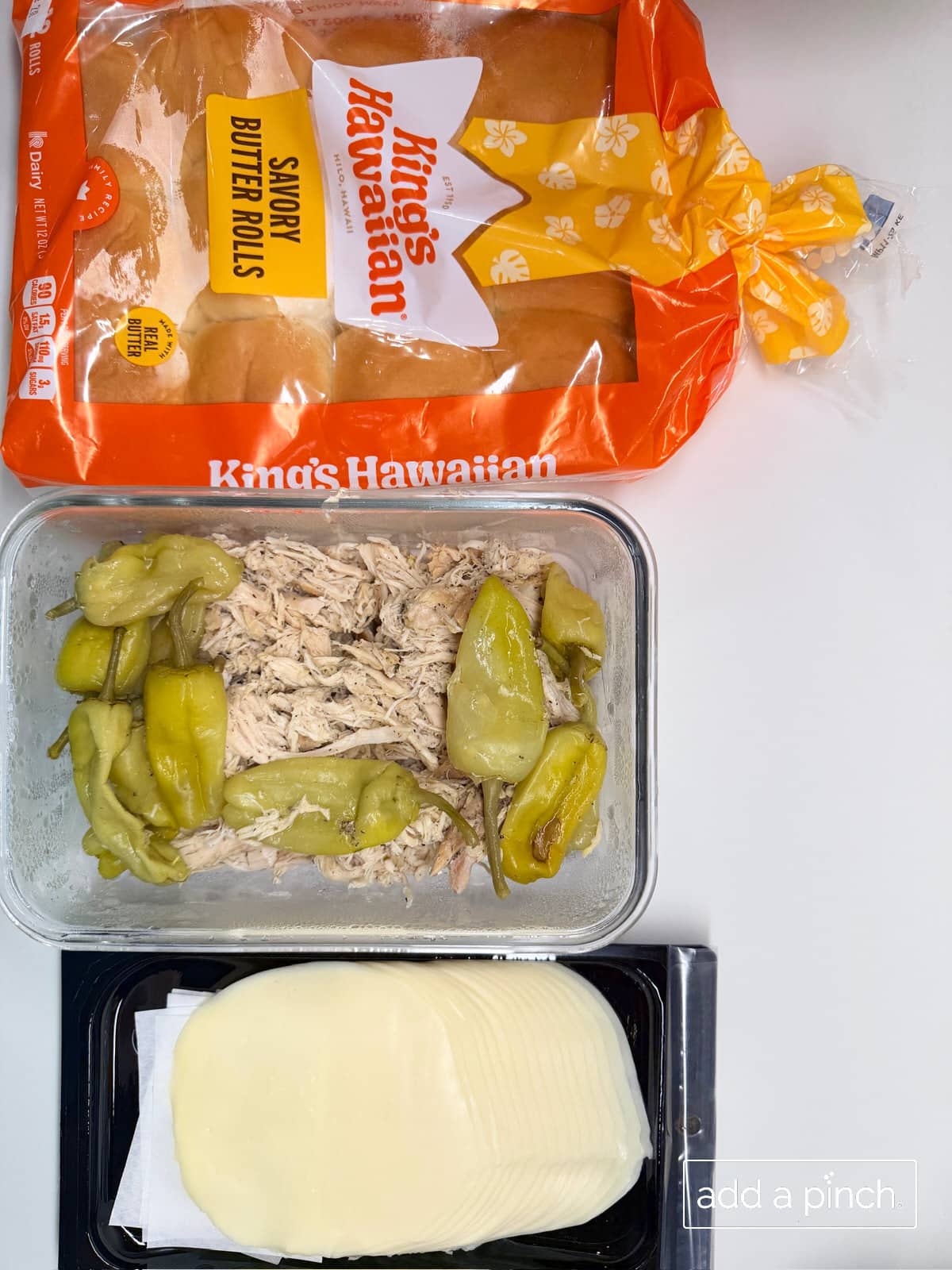 Mississippi chicken slider ingredients of mississippi chicken, provolone cheese, and slider rolls.